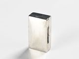 rectangular silver metal object on white background with shadow