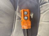 an orange device that is sitting on the seat of a car