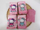 four hello kitty soap bars in a wicker basket on a table