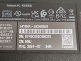 an image of a close up of a label on the back of a laptop