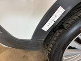a close up of a car tire with a sticker on it