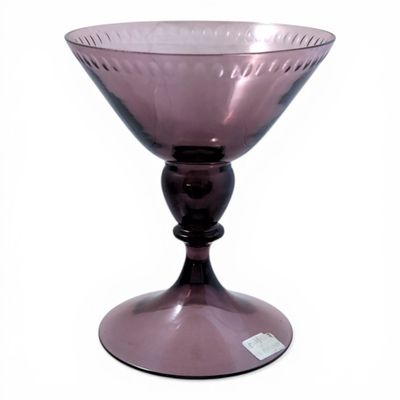 purple glass bowl on pedestal on white background with white background