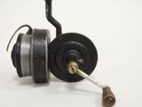 a close up of a fishing reel with a hook on it