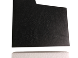 a black piece of paper on a white surface