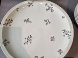 many plates and bowls sitting on a table