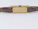an image of a wrist watch with a brown leather band