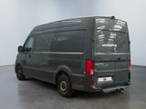 an image of a grey van parked in a room