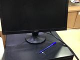 a monitor and keyboard on a desk in a store