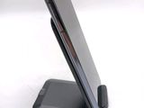 a cell phone that is sitting on top of a stand