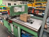 a machine that has a box on it in a factory