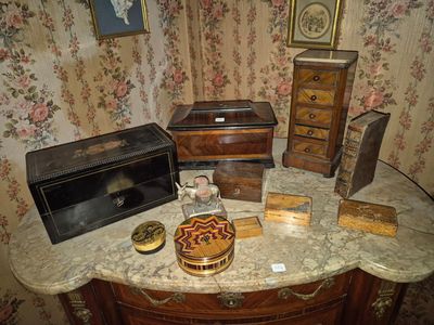 a table with a lot of antique items on top of it