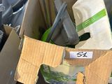 a cardboard box filled with assorted items on a table