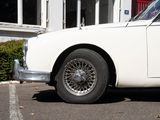a white car that is parked in front of a building