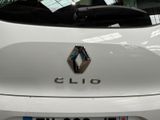 a close up of a white car with the name of a person on it