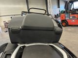 an image of a car with a luggage case on top of it