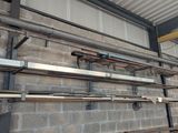 a wall of pipes and pipes on the side of a building