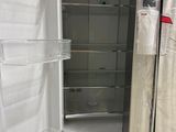 an image of a refrigerator that is being wrapped in plastic