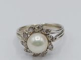 a white pearl and diamond ring