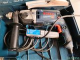 a drill and other tools in a blue box