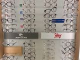 many pairs of glasses on display in a display case