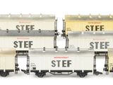 a train that is sitting on the tracks next to each other