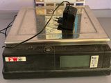 an image of a scale with a power cord on it