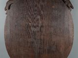 a close up of a wooden plaque on a white background