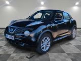 une photo d'un SUV Nissan Juke noir garé dans un garage