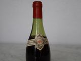 a bottle of wine that is sitting on a table