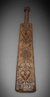 an image of a long piece of wood with a design on it