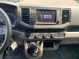a dashboard of a truck with a steering wheel and a dash board