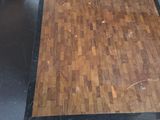 a wooden floor in the middle of a room