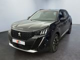 vue de face d'un SUV noir garé dans un showroom