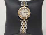 an image of a woman ' s wrist watch on a pillow
