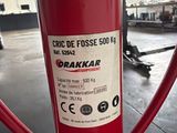 a red fire hydrant with a sticker on it in a building