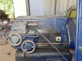 a blue machine that is sitting in a garage
