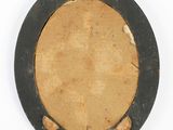 a picture of a round object on a white surface