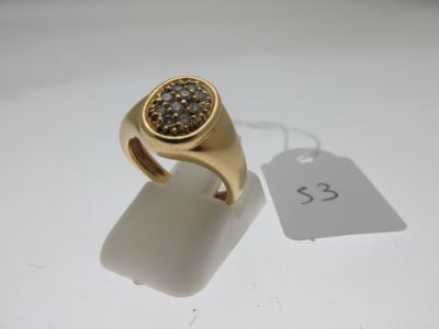 une image représentant une bague en or sertie d'un diamant brun