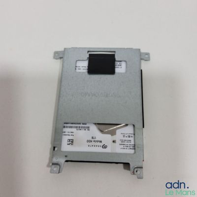 a close up of a hard drive on a white surface