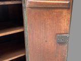 an old wooden cabinet with a door open