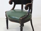 an image of a pair of chairs with green leather upholstered