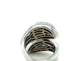 sterling silver ring with black and white diamonds on a white background