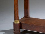 a wooden table with a clock on top of it