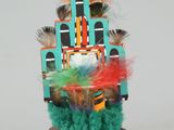 an image of a doll with a colorful headdress