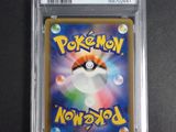 a close up of a pokemon card on a table