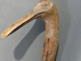 an image of a wooden duck head on a table