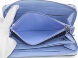 a blue purse with a rabbit hand sticking out of it