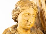a statue of a woman holding a baby in her arms