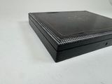 a black box that is sitting on a white table