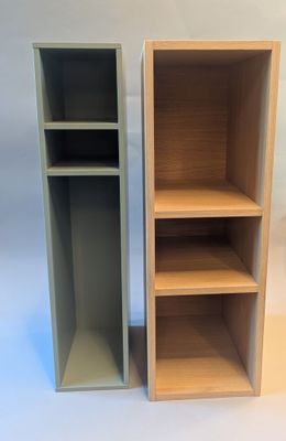 two shelves that are next to each other on a white surface